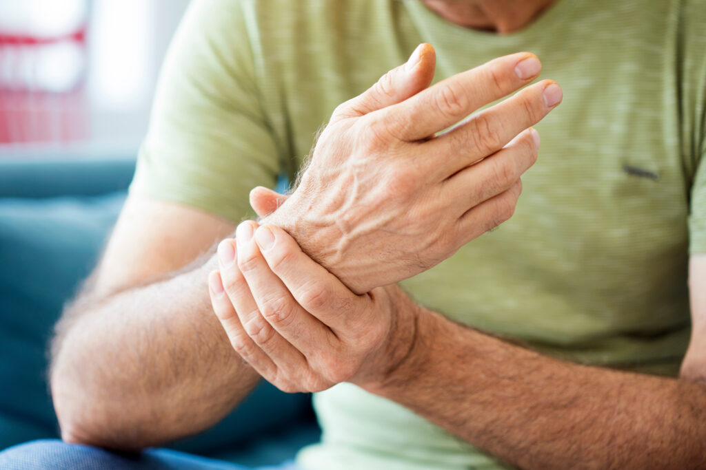Male hold his wrist