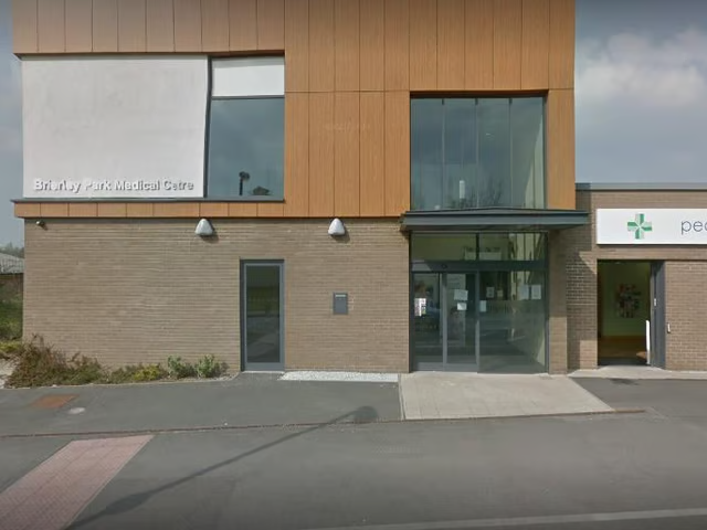 Brierley Park Medical Centre front of buiilding brown brick with lightbrown cladding next to a chemist. 