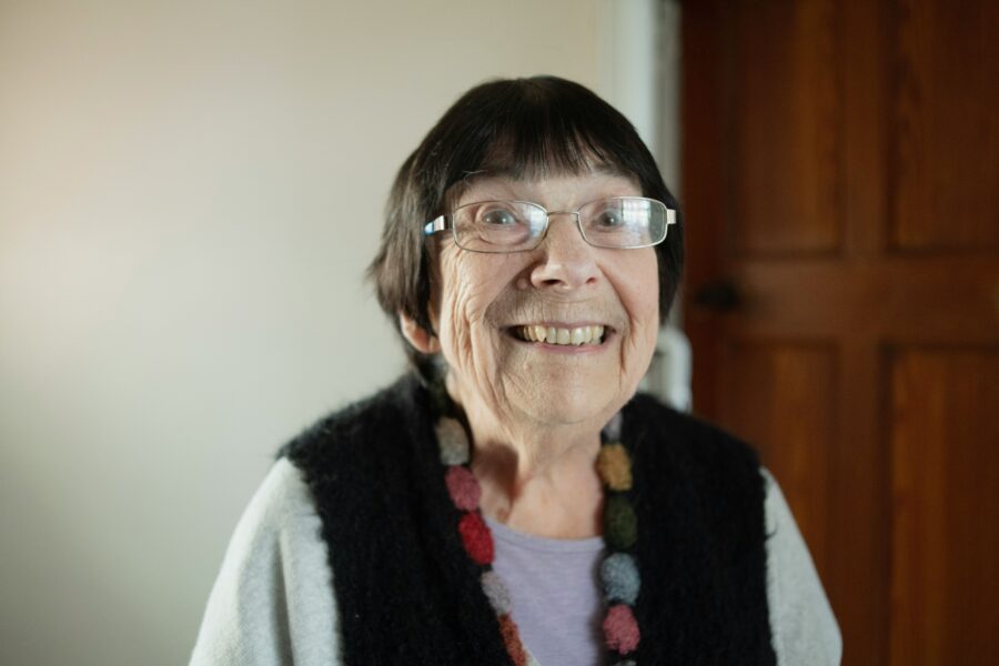 Elderly woman smiling at the camera