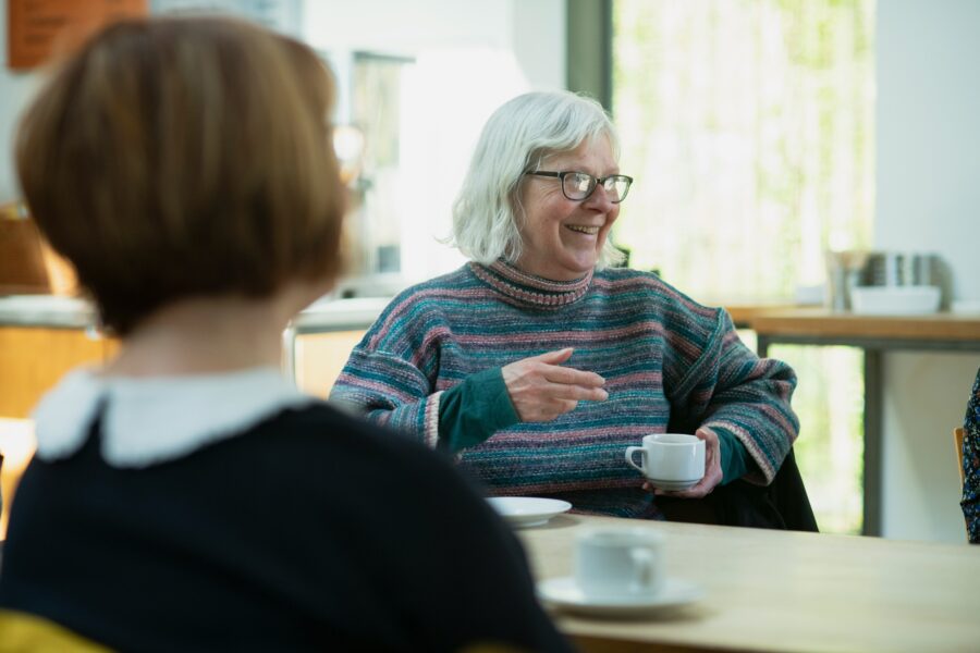 Woman smiling in group