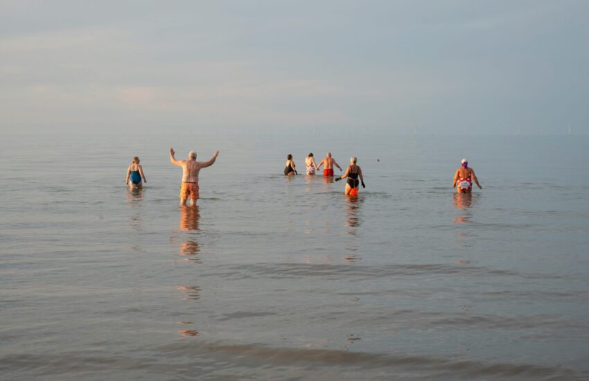 Group of people swimming in the sea