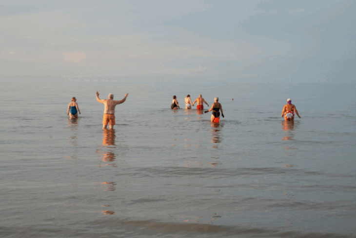 People swimming in sea